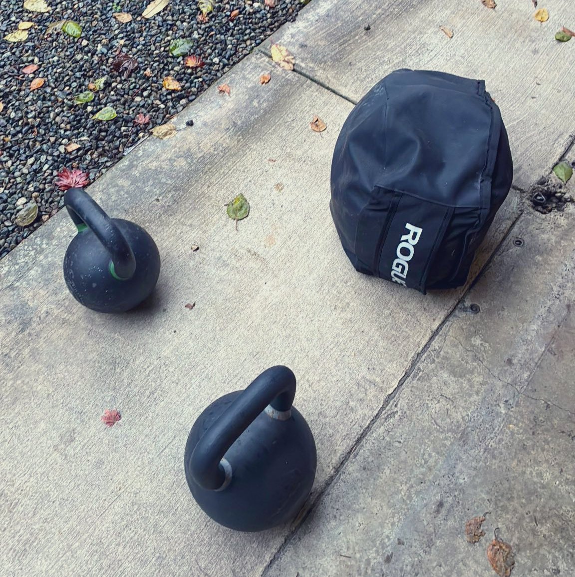 The new 80-pounder caught me by surprise. Nothing like finishing a workout with kettlebells in the rain to jump start the day.