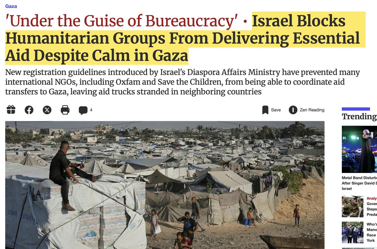Screenshot of Al Jazeera article titled Under the Guise of Bureaucracy Israel Blocks Humanitarian Groups from Delivering Essential Aid with text describing new registration guidelines introduced by Israel Diaspora Affairs Ministry preventing many international NGOs from entering Gaza including aid trucks stranded in neighboring countries and images of crowded displacement camps with tents people and metal structures in a desert area.