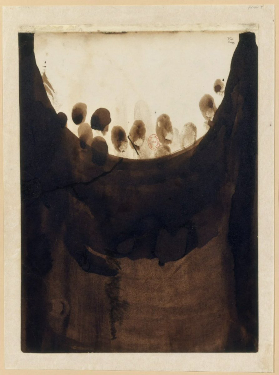 "Ink-blackened Page with Half Moon and Fingerprints" 1864-65 by Victor Hugo (1802-1885). Brown ink and wash on paper.