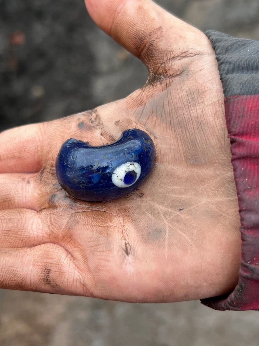 A glass bead with an eye dating to the Roman era. It was found on (31st October 2025) at the archaeological site at the Cricket Club in Carlisle, Cumbria, England. It was found by 11-year-old Verity Hetherington in the SPOIL HEAP.

The eye was worn for protection against the evil