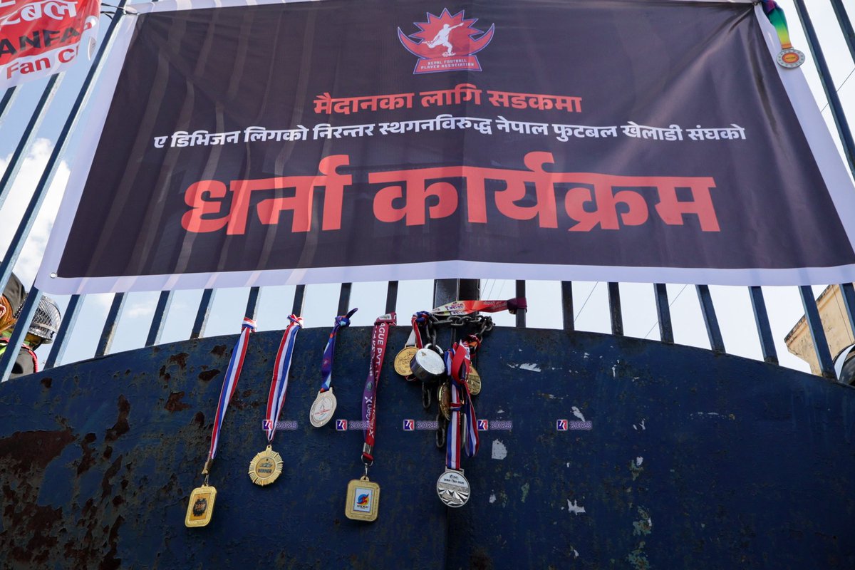 SubasTheOne_'s tweet photo. Such a heartbreaking scene here at @theanfaofficial premises this. After ANFA’s decision to postpone the A Division League for further 13 months (currently on 879 days since last held), the players reached ANFA demanding resumption of league. They were not allowed to enter the Complex as they locked the gate. The players staged protest on the street. They ended the program by handing over the medals they won in their playing career at the gate.

Tough to see players having to come to streets for basic rights. Hopefully @FIFAcom @theafcdotcom @FIFPRO see this.
