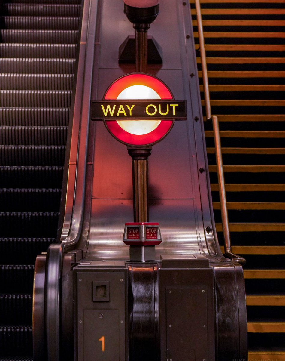 SEP / SWISS COTTAGE 
Photography from my 2026 Calendar

There are many unique signs to discover as you explore the London Underground network. I love the 'way out' roundel at the foot of the escalators at Swiss Cottage tube station.