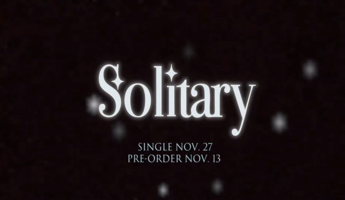 Black background with the word SOLITARY in large white stylized font with decorative star elements around it repeated twice at the top and bottom the text single Nov 27 centered below the title and PRE-ORDER NOV 13 in smaller white font at the bottom.