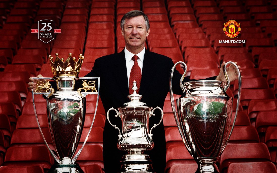 Sir Alex Ferguson with trophies