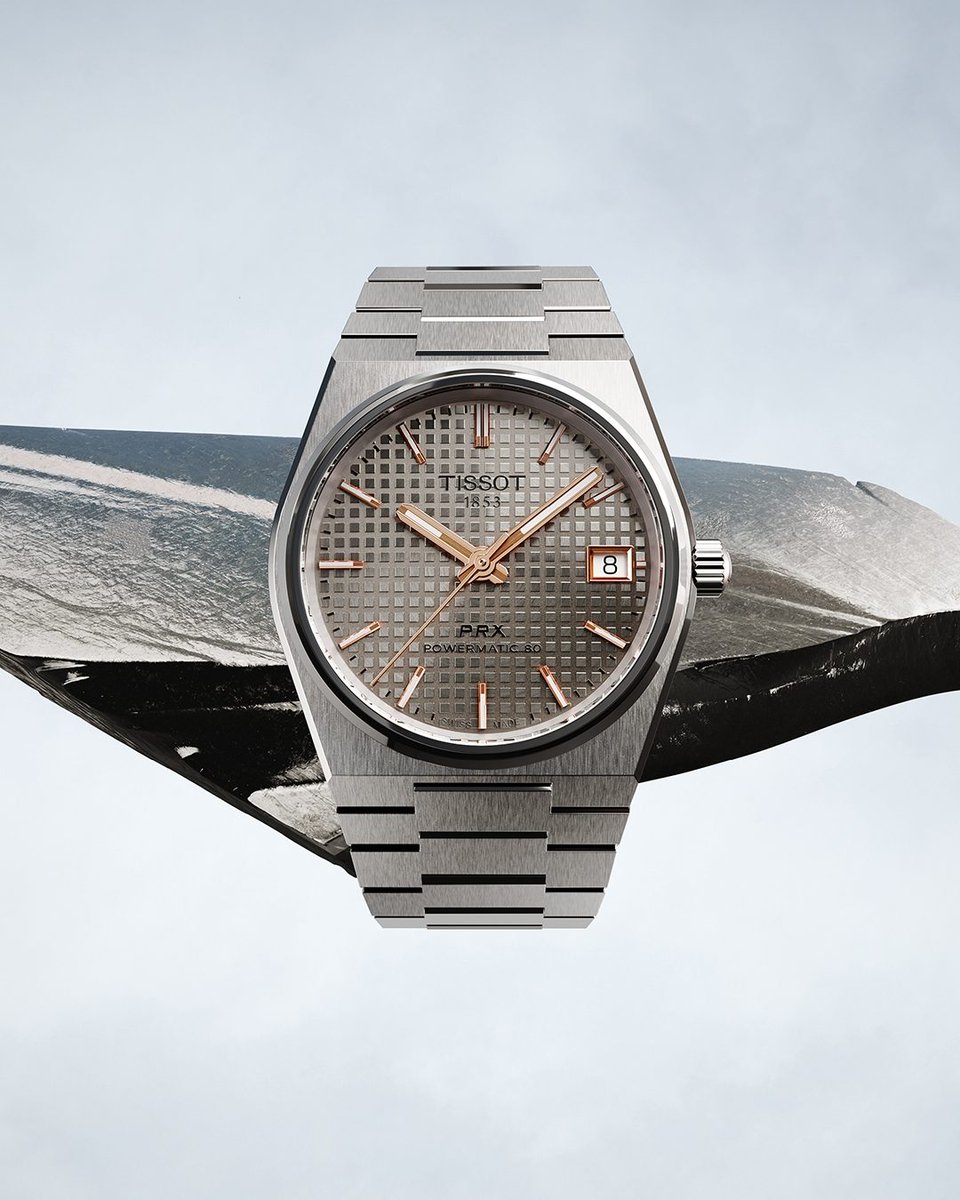 TISSOT's tweet image. The Tissot PRX 38mm is finally here! Fully crafted in titanium, it combines lightness with a modern, refined design.