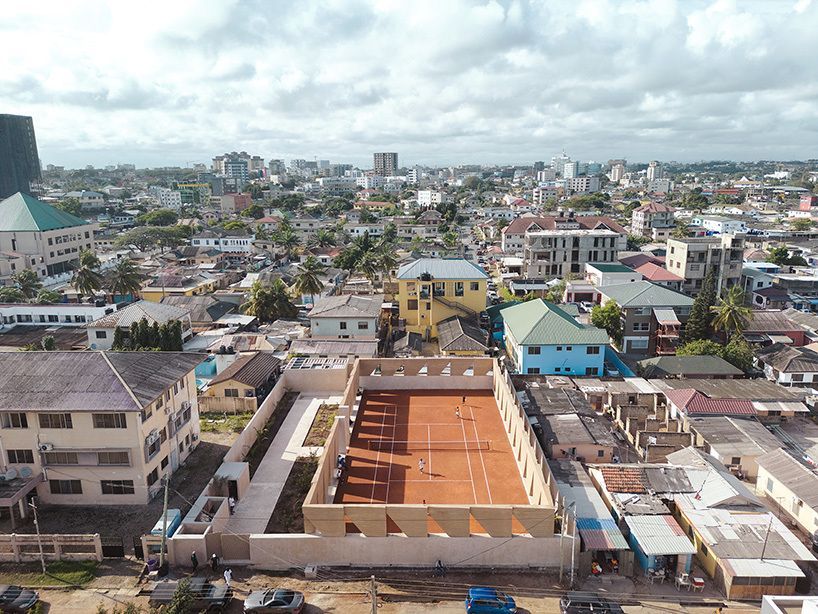 designboom's tweet photo. ghana's first precast rammed earth project by deroche projects hosts community tennis court 🎾  https://t.co/gClBJyFtfI https://t.co/sxjk9jNwPv