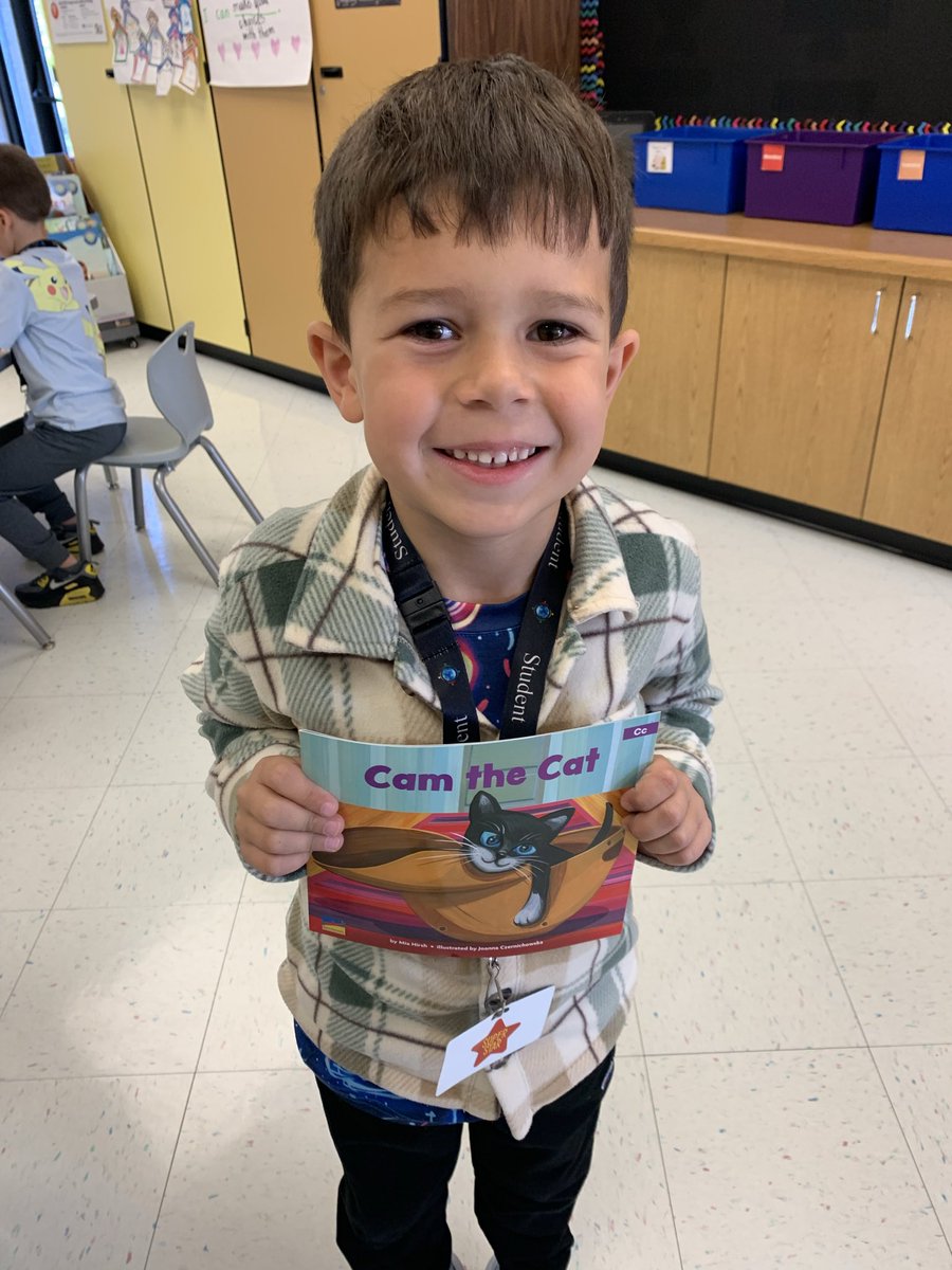 Someone was VERY excited to have his name in a book this morning! 🥰🐈‍⬛#BulldogBest🐾  #ThriveIn95💙