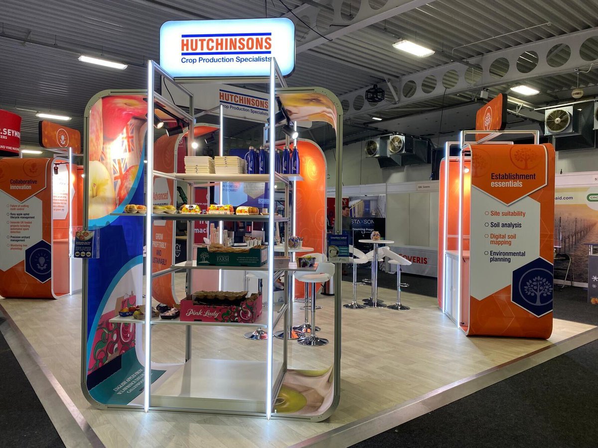 EventsWithJBE's tweet photo. We loved being back at Kent Showground this week, working at the @Nationalfruit show, delivering a new stand for @HutchinsonsAgUK.

Backlit feature graphics, bespoke light boxes, neon effect light strips &amp; striking curved pods really elevated the stand.

#NationalFruitShow https://t.co/enMC9lpONK