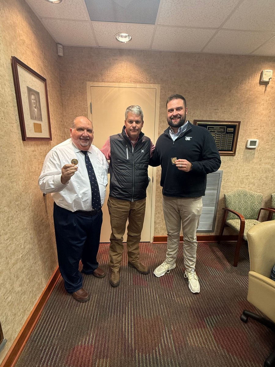 NCPCM's tweet image. Beau Waddell presented commemorative coins to Gary Harris and Zack Bumgarner for their quick disaster support. Their teamwork embodies the spirit of NCPCM! 💪 #NCPCM #CommunitySupport #LeadershipInAction #WeLeadTogether #MemberAppreciation