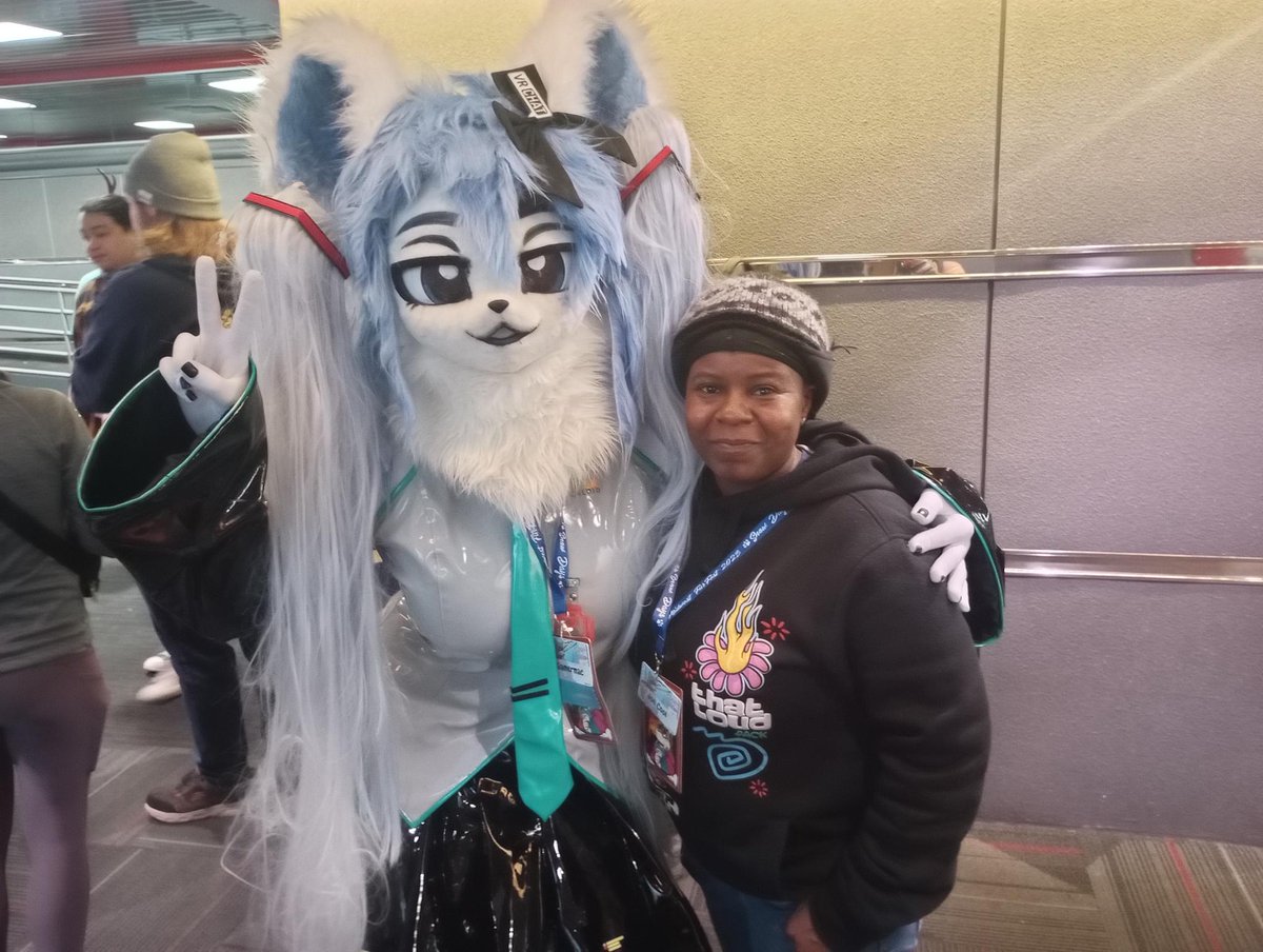 Any amount you can send helps. Even "just" $1 is extremely helpful, please don't convince yourself it isn't!! If you've ever enjoyed my art, please consider it. Here she is at MFF 2023 because I was scared to go alone. (Idk who the suiter is!) She's always supported me. 🥺