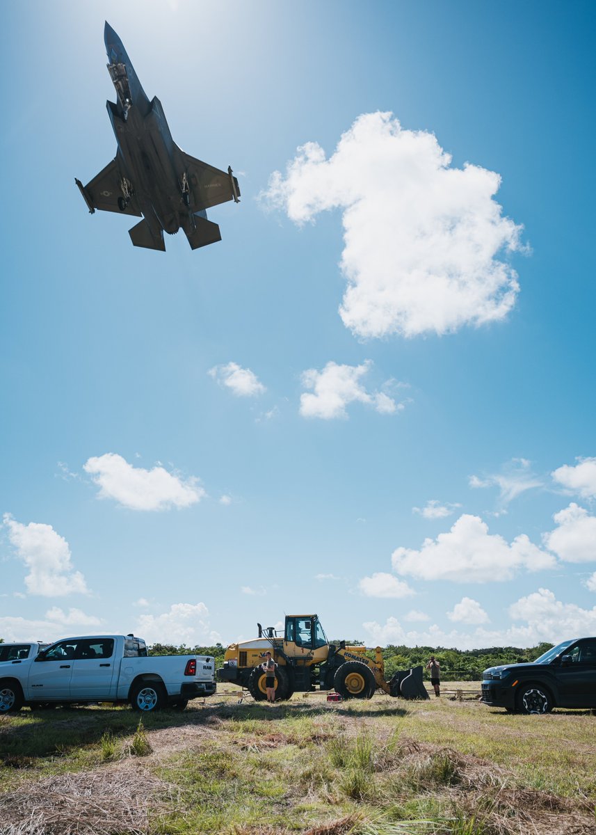 Southcom's tweet image. A U.S. Marine Corps F-35B Lighting II flies over 53rd Combat Airfield Operations Squadron Airmen operating a wheel loader in Ceiba, Puerto Rico. U.S. military forces are deployed to the Caribbean in support of the #SOUTHCOM mission, @DeptofWar-directed operations, and @POTUS&apos;…