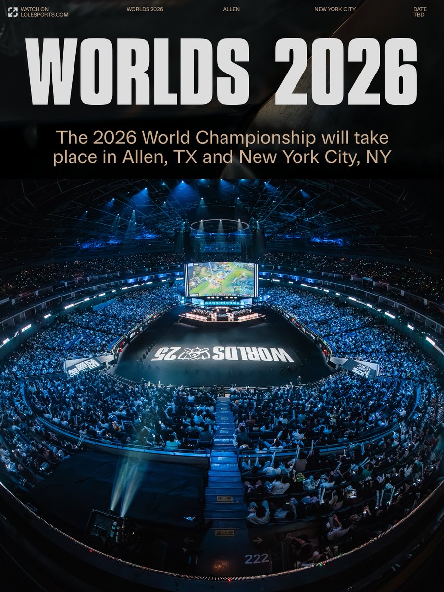 Graphic poster with Worlds 2026 title in bold letters above text stating the 2026 World Championship will take place in Allen TX and New York City NY. Below is a wide-angle view of a large indoor arena filled with seating tiers and a central stage featuring League of Legends branding on the floor under bright stage lights and a domed ceiling.
