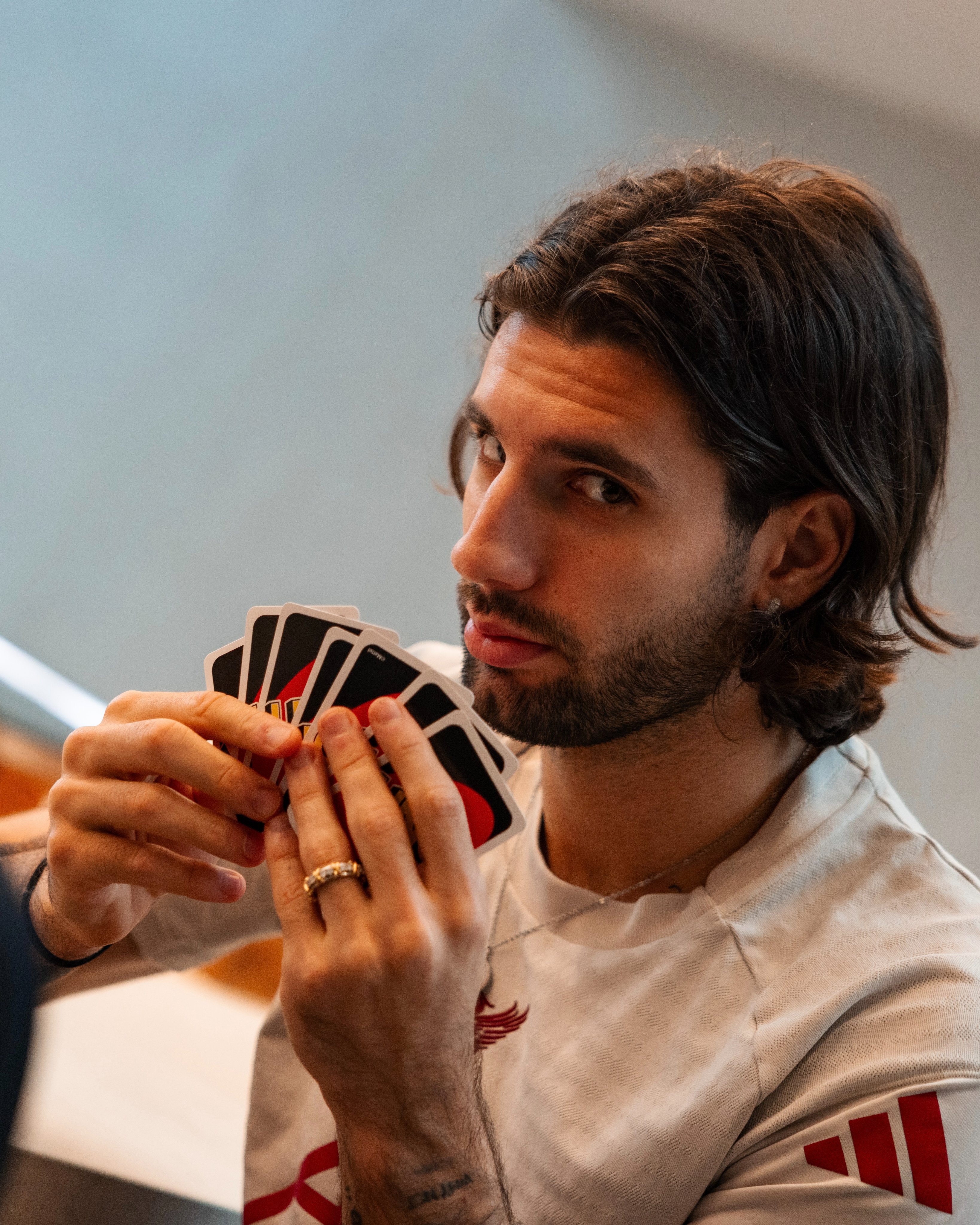 Photography of Dominik Szoboszlai playing Uno.