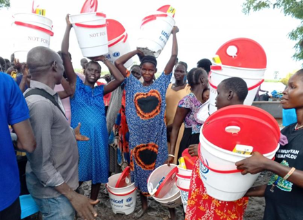 From clean hands to safe water: preventing illness and improving our children’s nutrition. With pride and hope, mothers receive emergency WASH NFIs support during distribution at Khorfulus Nutrition Centre in Canal/Pigi County, Jonglei County