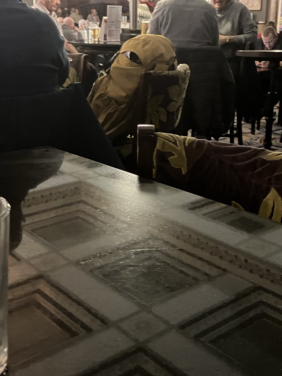 isisinventory's tweet photo. In ‘Spoons Harrogate and this angry bag is watching me!!!! X https://t.co/IS9aQfirR7