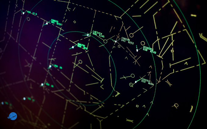 A dark radar screen interface displays multiple green and yellow concentric circles representing range rings, with white lines indicating headings or tracks, numerous small green dots and clusters marking detected objects or aircraft positions, numerical labels such as 270 and 340 likely denoting azimuth angles in degrees, and additional geometric overlays including arcs and crosshairs for navigation data visualization in an air traffic control context.