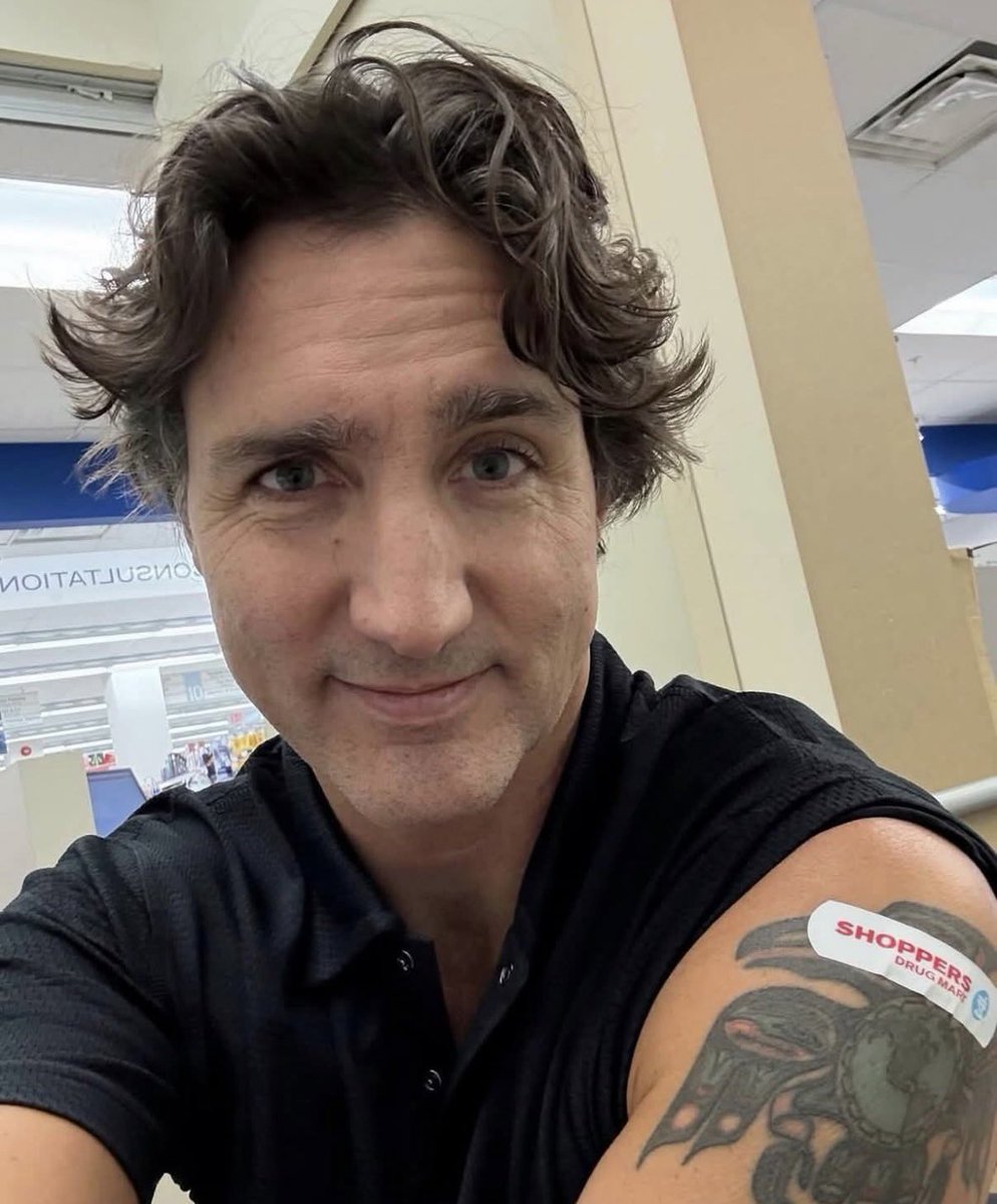 harryfisherEMTP's tweet photo. Justin Trudeau has a Haida style raven on his arm, one of the oldest symbols in North America. In the old stories the raven isnt a villain. Though it is a trickster, it steals light from the darkness and gives it to mankind. Its eye represents sight, cunning, the will to see through illusion.

Look at the photo again, the injection bandage sits squarely over that eye, the raven’s sight covered, its vision pierced. A coincidence, sure, but a perfect one.
 This portrays what our age has done to itself. We’ve traded revelation for regulation, sight for simplicity. So afraid to rock the boat we stay on our knees. 

The “mark” on Trudeau’s arm wasn’t just a shot, it was a photograph of a civilization gone half blind, proud of its tech, detached from its soul, busy congratulating itself while the light fades from the people’s eyes.

God help us