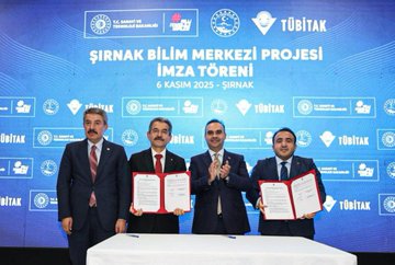 First image shows four men in suits standing at a podium with TÜBİTAK and Şırnak Bilim Merkezi Projesi banners, holding signed documents during a signing ceremony. Second image depicts a large group of people in formal attire cutting a ribbon in front of a Bölge Kalkınma İdaresi banner for a project opening. Third image displays a modern workshop interior with gray tables, stools, yellow storage boxes, and wall displays of plates in a scientific setting. Fourth image features a diverse group of people posing in front of a TÜBİTAK banner in a workspace with workbenches and aviation models.