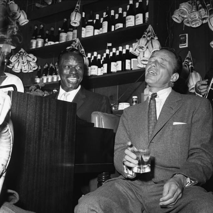 Frank Sinatra with Nat King Cole at Villa Capri... 
by Bernie Abramson, 1955 .   2 giants!