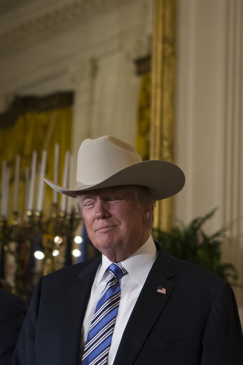 MythoMAGA's tweet image. July 17, 2017: Trump sports a cowboy hat during the Made in America product showcase.
Another rare Trump