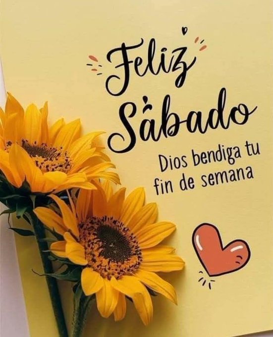Two vibrant yellow sunflowers with green stems positioned on a light yellow background resembling a note card. Handwritten-style black text reads Feliz Sabado at the top with decorative swirls. Below it, Dios bendiga tu fin de semana in smaller font. A small red heart icon appears near the bottom right.