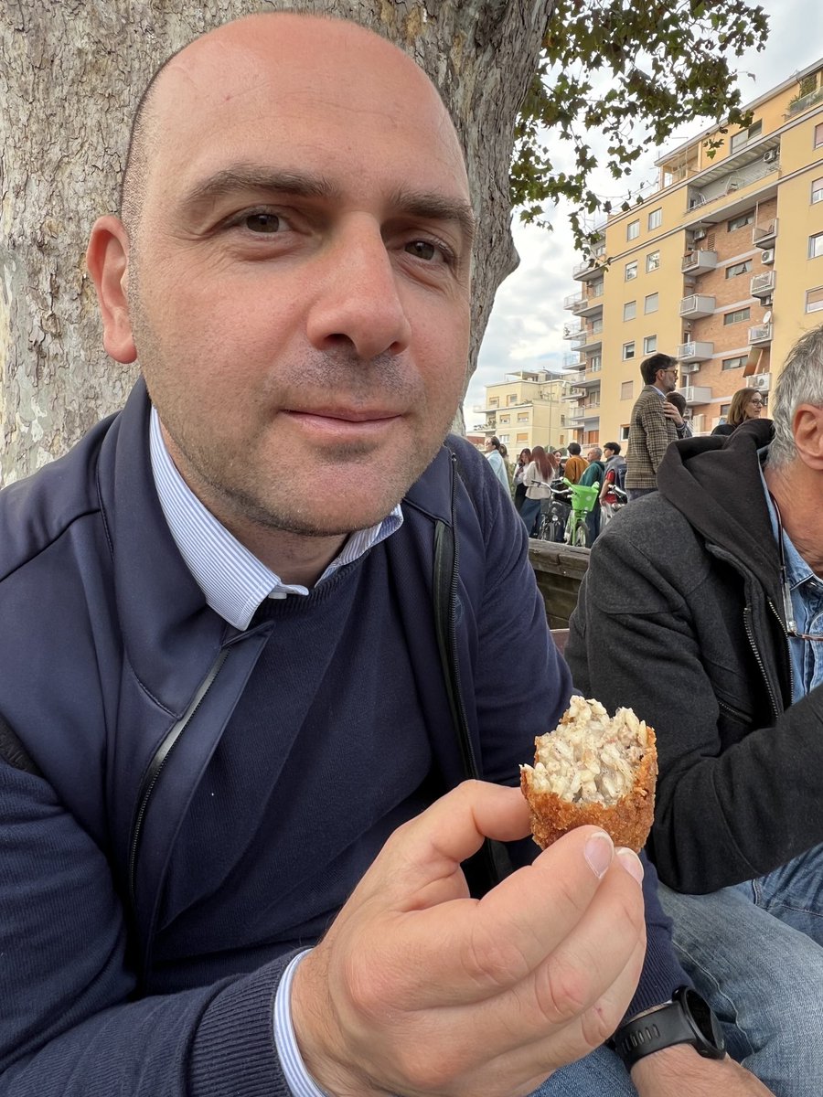 tomkington's tweet image. Massive crowds at Rome’s Milvian Bridge - I thought there was a football game at the nearby stadium but the mob was much bigger than that. Turns out there’s a festival of supplì - the Roman fried rice and mozzarella ball. This man showed up early to beat the biblical queue