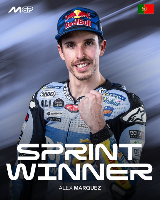 Alex Marquez wears a blue and white racing suit with sponsor logos including Michelin, Gresini, and Red Bull, and a matching cap, standing with a fist pump gesture against a blurred background with Portuguese flag elements. Bold text overlay reads SPRINT WINNER ALEX MARQUEZ.