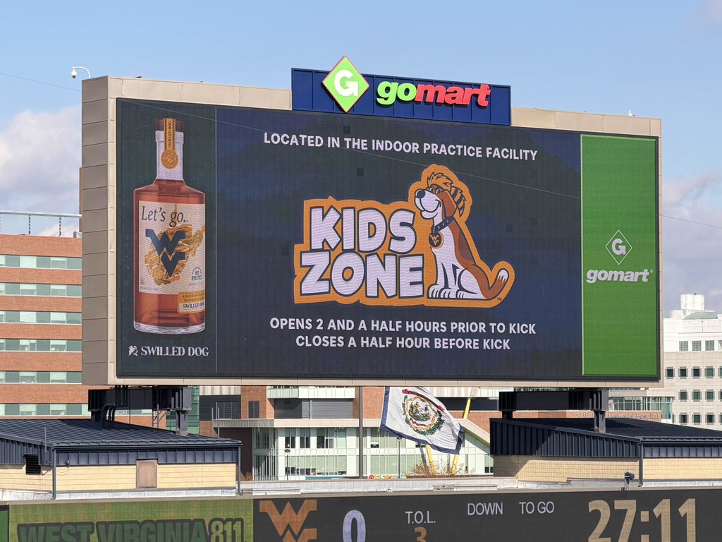 SickosCommittee's tweet photo. Only at West Virginia is the kid zone advertisement up next to a whiskey advertisement. https://t.co/aFeTa1ZzTu