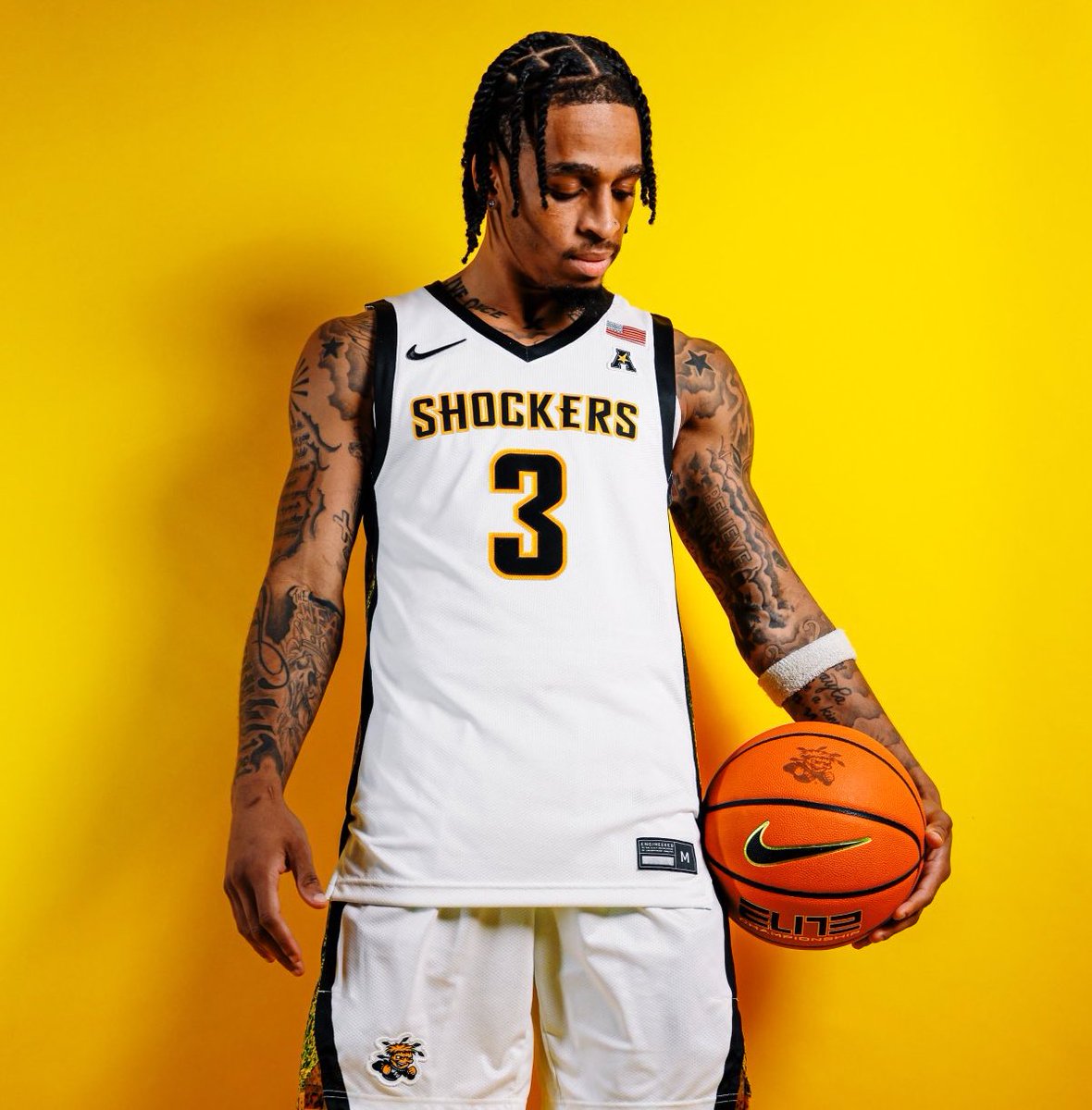 A side-by-side comparison of the last Nike home uniform (2016-17) and the newest one (right) that Wichita State will debut tonight.

No more cursive Shockers. Can’t see it in this picture, but new jerseys have a black/yellow paint splatter trim on the sides too.