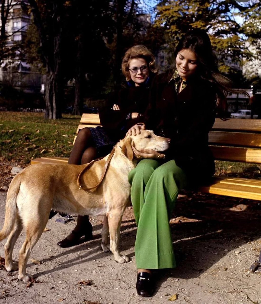 Princess Grace Kelly of Monaco with her daughter, Princess Caroline, and their dog on a walk in Paris in 1972.