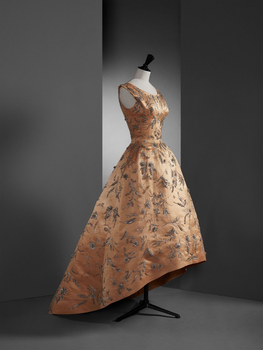 kateStrasdin's tweet photo. A delectable description, this late #1950s Balenciaga is a ginger coloured shantung silk with silver embroidery and sequins. It has an asymmetric hem that sweeps behind the wearer @museobalenciaga #fashionhistory https://t.co/2OpH9gAsqV