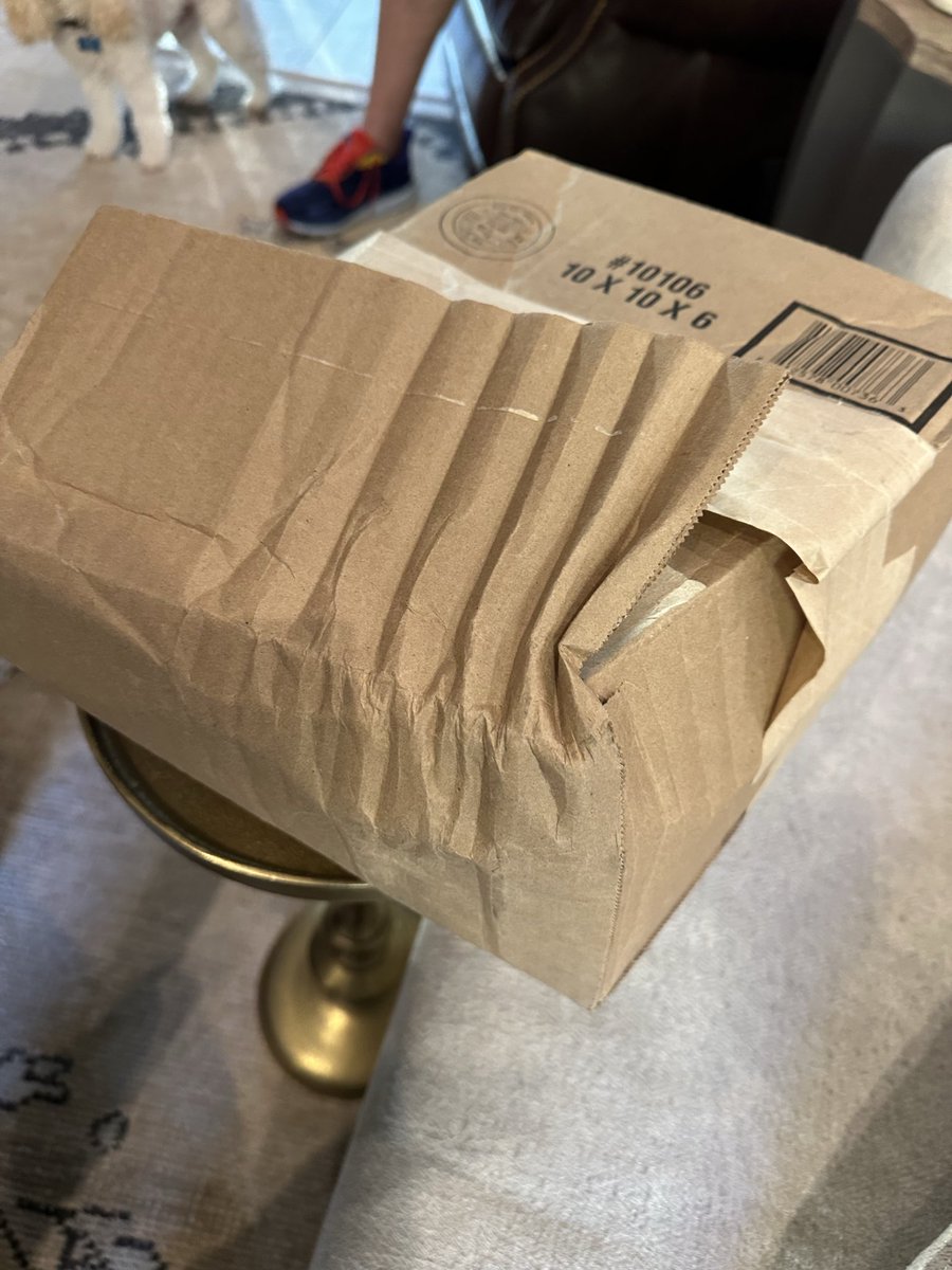 liznangle's tweet photo. @UPS I’d like to think this was an accident, but it appears to not be. Looks like my package was stomped…repeatedly. Given that it was merch from @TPUSA , this is very disappointing and sad. I ordered this after Charlie’s assassination, and to receive it like this is awful! https://t.co/SddlX9Z9Je