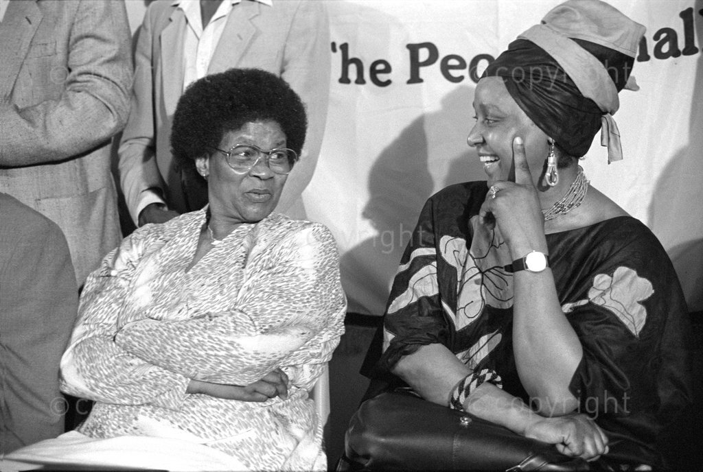 HistorySAZAR's tweet photo. Albertina Sisulu and Winnie Madikizela Mandela at the press conference after Govan Mbeki's release from Robben Island, 1987. Photo: Gille de Vlieg https://t.co/pLbpff0t5r