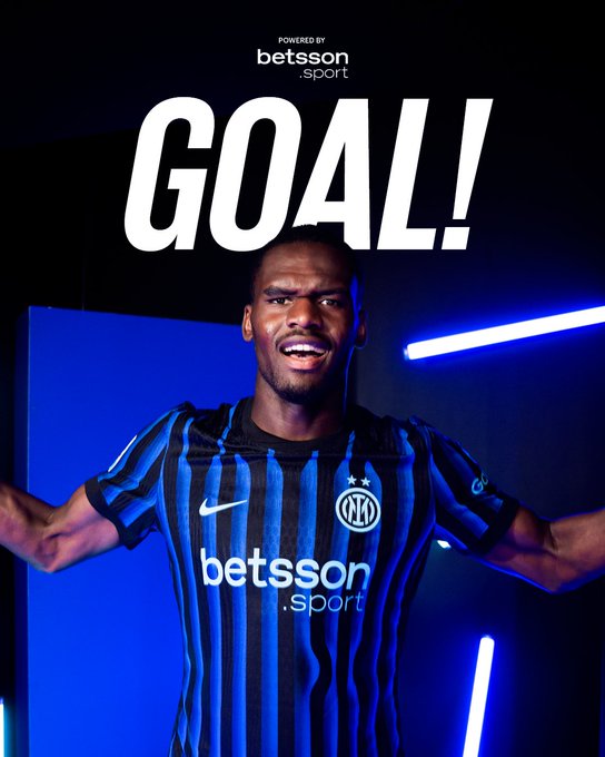 A male athlete with muscular build and short hair wears a blue and black vertical striped soccer jersey with Nike swoosh, Inter Milan crest on left chest, and Betsson sponsor logo on front. He stands smiling with mouth open and arms spread wide in celebration pose. Background features a blue wall with vertical neon blue lights and a dark doorway frame. Large white text GOAL! overlays the top center.