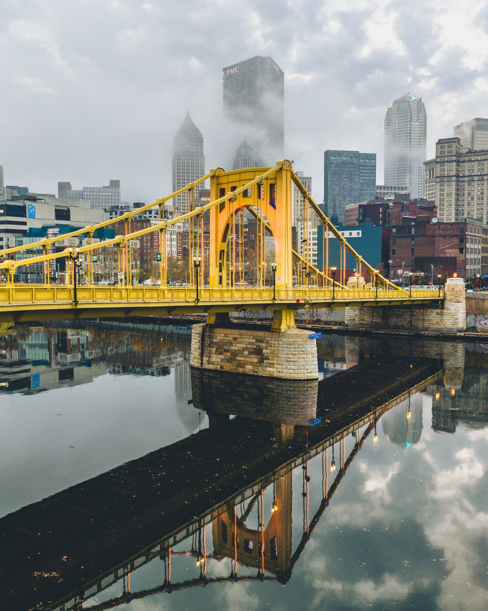 The Warhol Bridge reflects in the Allegheny River as fog moves through Downtown Pittsburgh this morning. #pittsburgh