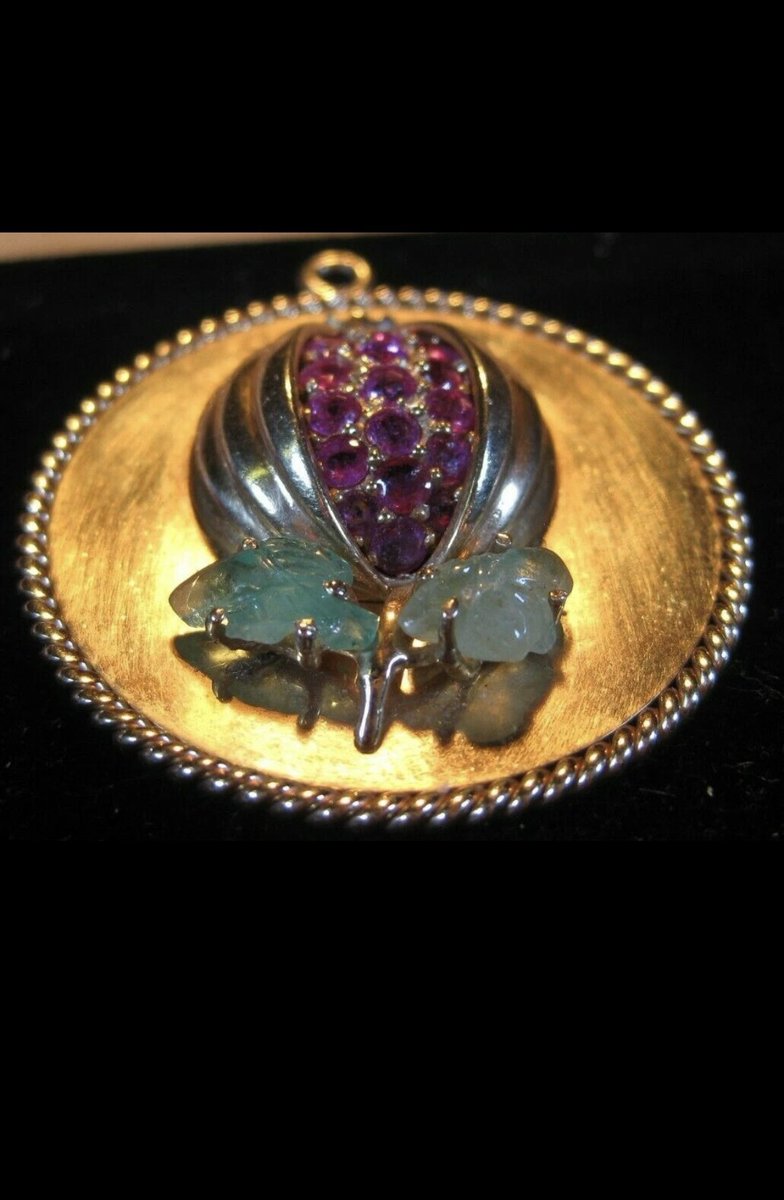 Opium Poppy pendent , only one in the world like it … pink rubies , Colombian emeralds set into 14karat.