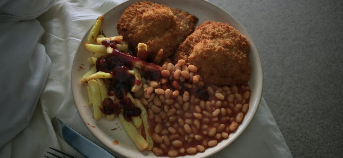 Chicken Kiev's chips and beans and BBQ sauce