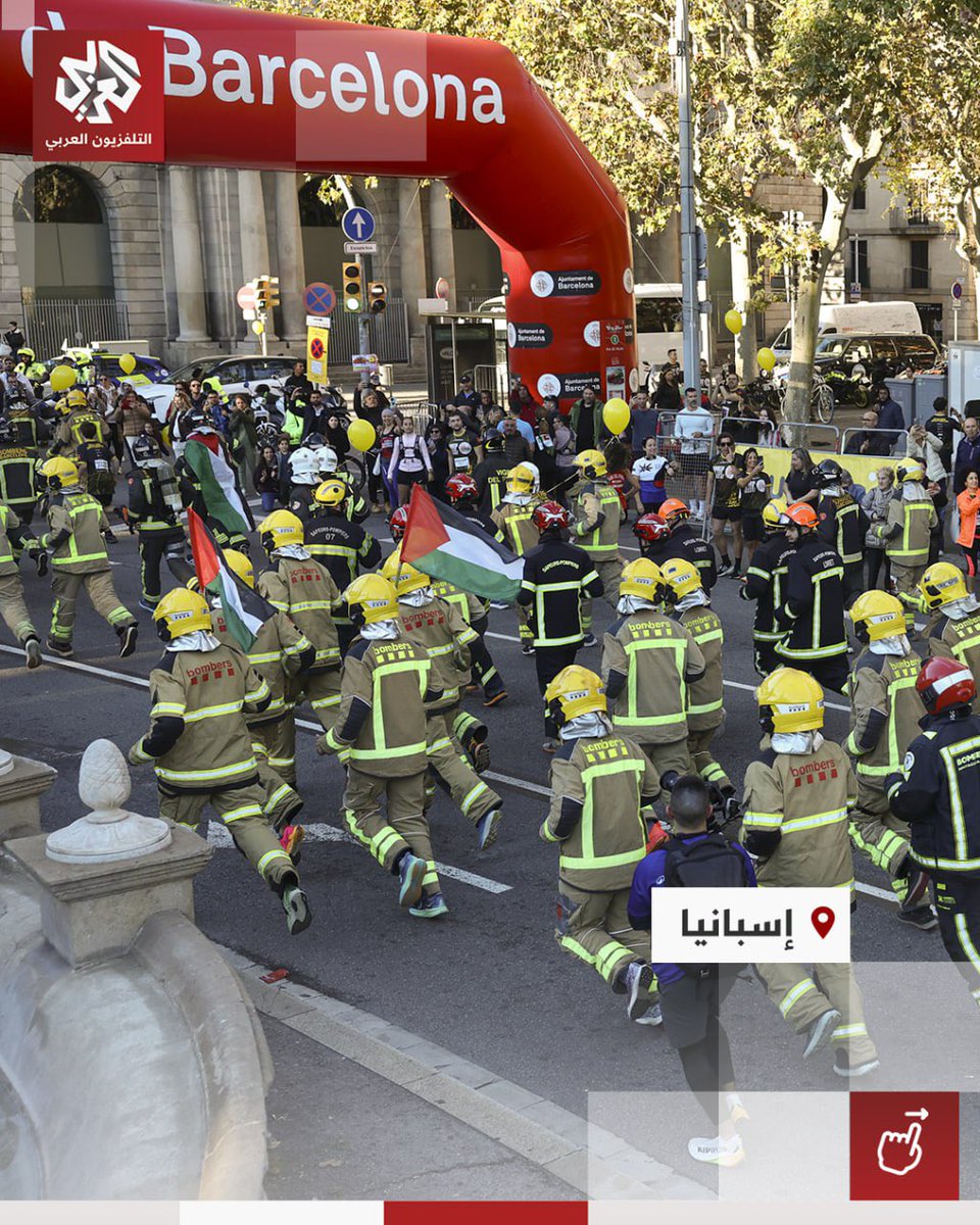 Timesofgaza's tweet photo. Firefighters raise Palestinian flags during a race in Barcelona. https://t.co/tZu7AXLNq9