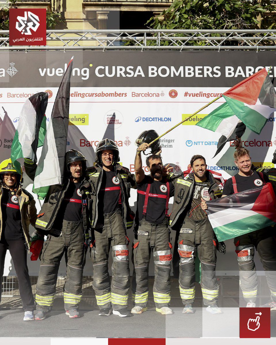 Timesofgaza's tweet photo. Firefighters raise Palestinian flags during a race in Barcelona. https://t.co/tZu7AXLNq9