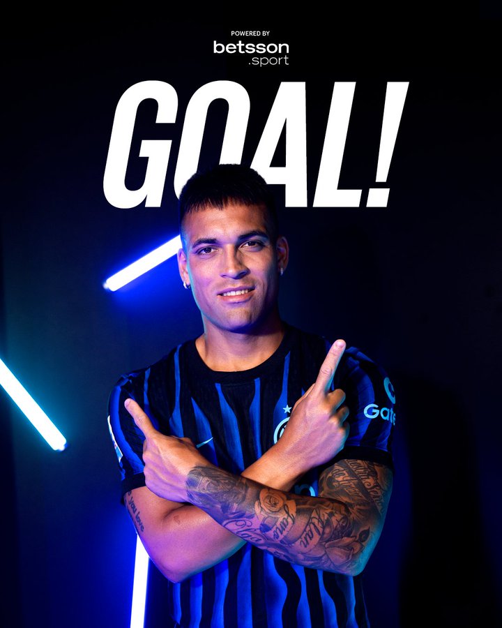 A male athlete with short dark hair and tattoos on his arms stands smiling confidently, wearing a black and blue striped soccer jersey with the Inter Milan logo on the chest and sponsor patches, posing with both hands raised forming peace signs at shoulder height. Neon blue light strips glow vertically behind him on a dark background. Large white text reading GOAL! is centered above his head. A Betsson logo is visible at the bottom right.
