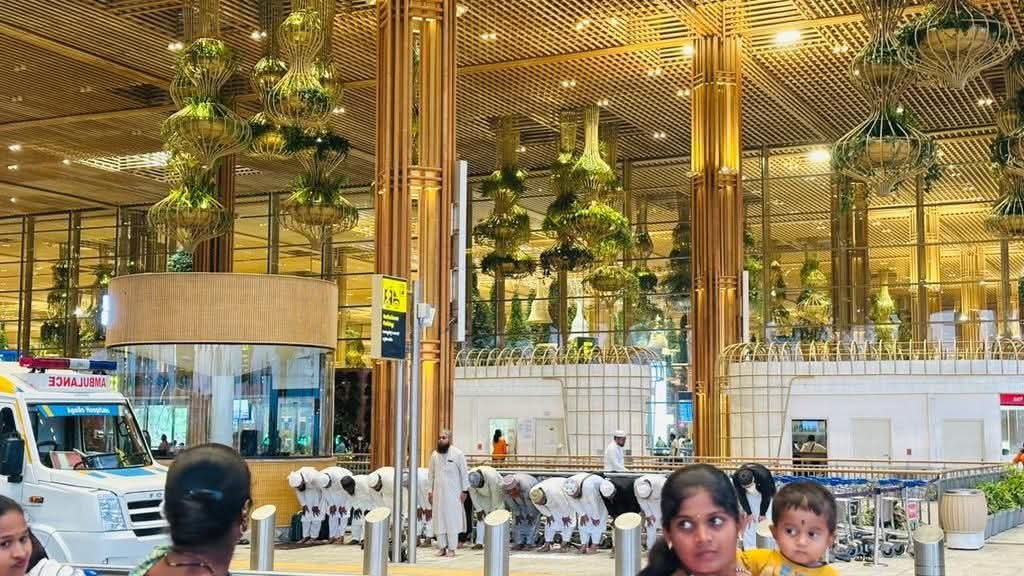 KiranAradhyaadv's tweet photo. Should Muslims be banned from airports now?

Because if @PriyankKharge wants RSS banned for "cultural activities in public spaces," then namaz at @blrairport_kn terminal, right under the chandeliers, must be a national security threat, right?

Public space hai na, bhai? New rules apply to everyone or just the ones you don’t like?

Hope @AAI_Official has conducted a thorough sweep of the terminal after this act and deployed all possible squads. Don’t gamble with passenger safety just to look “balanced.”

As per the new notification, gatherings of more than 10 people in public spaces without prior permission are illegal, and I can clearly see more than 15 here 👇

How many of you believe @BlrCityPolice has the courage to take suo motu action?

Retweet if you think they won’t.