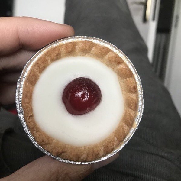 NoContextBrits's tweet image. How to eat a Cherry Bakewell.