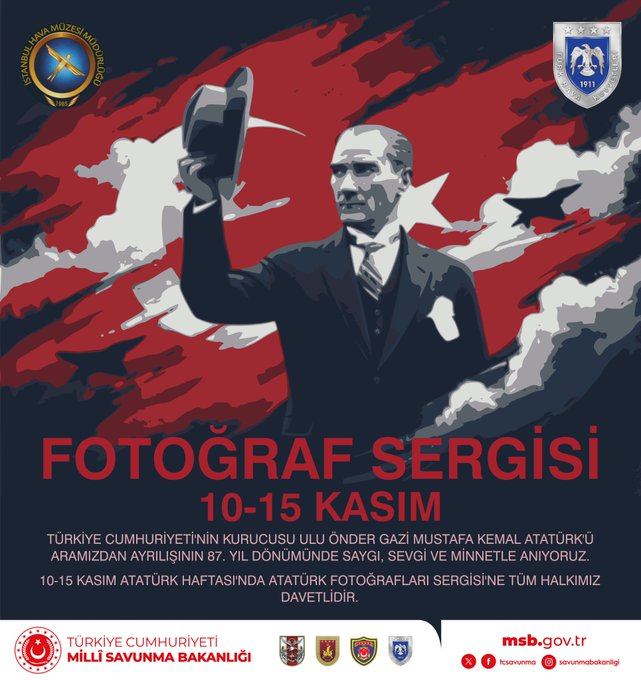 Graphic design poster featuring a central portrait of Mustafa Kemal Atatürk in formal suit and hat raising his hand against a background of the Turkish flag with white clouds and stars. Text overlays in Turkish announce Fototograf Sergisi from 10-15 Kasim commemorating Gazi Mustafa Kemal Atatürk with details on the event at Istanbul Hava Muzesi Mudurlugu organized by Milli Savunma Bakanligi. Logos of Turkish Republic and ministry appear at the bottom.
