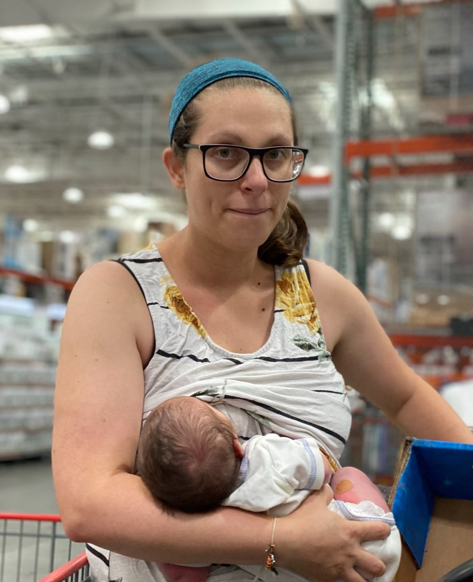 bethanyshondark's tweet image. Here’s a photo of me with a 48 hour old baby,  nursing him in line at Costco. (Child took it, hence the weird look)