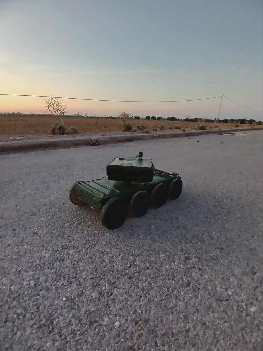 AzizHouidi's tweet photo. World, meet my tank-robot prototype, UGV concept:
 -designed &amp; built at home from wood, electric motors, and custom electronics 
 - Full movement, rotating turret 
 - adapted for reconnaissance, equipped with a cannon for necessary situations
 -inspired by Ukraine’s use of UGVs https://t.co/2E1eXtFaaM