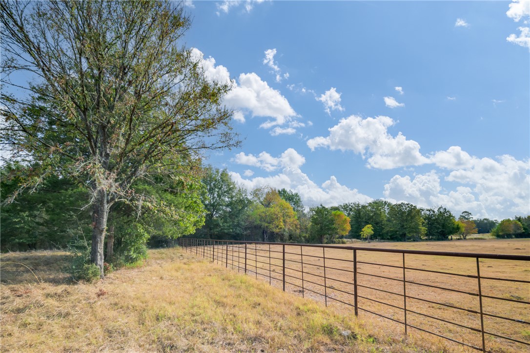 Fenced 10-acre country retreat in Bedias, TX! 🌳 Includes farmhouse, pond, cross-fencing, and two pole barns. Perfect for livestock or a quiet escape, close to BCS/Huntsville. #TexasLand #CountryLiving #BediasTX #ForSale