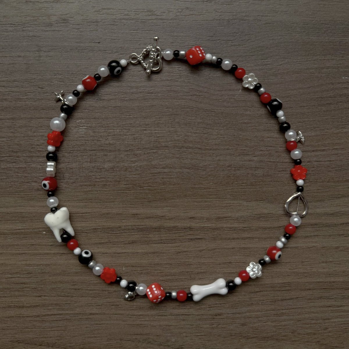 i gave <a href="/joshuadun/">josh dun</a> a necklace i made and he wore it the day after at breach chula vista :’) #cliqueart