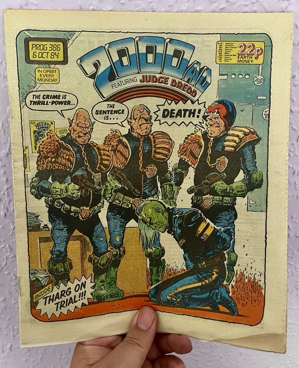 Prog 386

Tharg's arch-enemies, The Dictators Of Zrag strike again. You'd think the arch enemy of the editor of 2000 AD would be Stan Lee.
I can't quite work out whether the office carpet is on fire here or if its mouldy wallpaper.