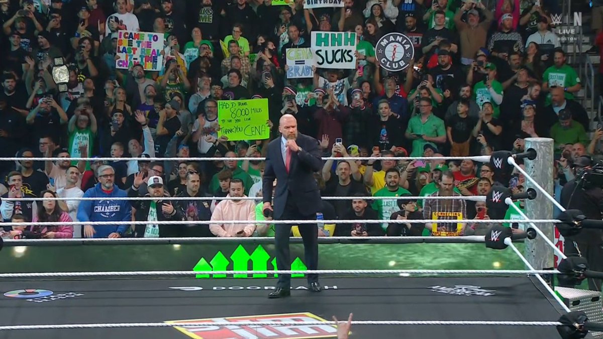 Bruh got the sign right behind Triple H😭😂 #WWERaw