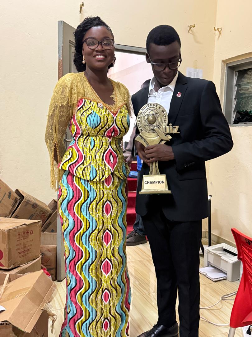 Though not in the best setting, I was privileged to have Dr. Ohene-Agyei take my last pictures as NSMQ Champion with me before I handed over the trophy at the #NSMQ2025 Grand Finale. In one, I was making sure that the school crest on my suit was still straight😂😌⚫️🔴
<a href="/Thelma_OA/">Thelma Ohene-Agyei</a>